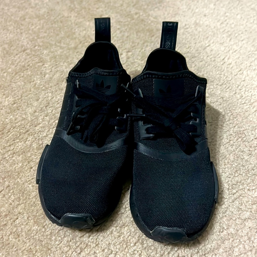 All black Adidas NMD Sneakers